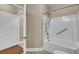 Well-lit bathroom featuring a tiled floor and bathtub-shower combination at 1505 Basildon Rd, Mount Pleasant, SC 29466
