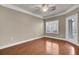 This bedroom has hardwood floors, ceiling fan, and a door to the outside at 1505 Basildon Rd, Mount Pleasant, SC 29466