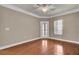 This bedroom has hardwood floors, ceiling fan, and a door to the outside at 1505 Basildon Rd, Mount Pleasant, SC 29466