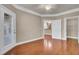 Bright bedroom featuring a ceiling fan, light beige walls, and dark wood-look floors at 1505 Basildon Rd, Mount Pleasant, SC 29466