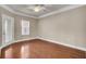 This bedroom has a ceiling fan, hardwood floors, and a door to the outside at 1505 Basildon Rd, Mount Pleasant, SC 29466
