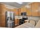 A modern kitchen featuring stainless steel appliances, granite countertops, and ample cabinet space at 1505 Basildon Rd, Mount Pleasant, SC 29466