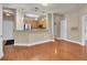 A bright and airy living space with views into the kitchen, hardwood floors, and neutral paint colors at 1505 Basildon Rd, Mount Pleasant, SC 29466