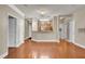 Spacious living room showcasing hardwood flooring and providing an open view into the kitchen and other rooms at 1505 Basildon Rd, Mount Pleasant, SC 29466