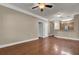 The living room has hardwood floors, ceiling fan, and trim at 1505 Basildon Rd, Mount Pleasant, SC 29466