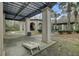 Outdoor entertainment area with pergola, a fireplace, and cornhole boards at 1505 Basildon Rd, Mount Pleasant, SC 29466