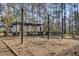 Community playground surrounded by towering trees, offering a shaded play area at 1505 Basildon Rd, Mount Pleasant, SC 29466
