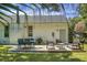 Spacious backyard features a patio area with ample seating, a well-maintained lawn, and mature landscaping at 1520 Wakendaw Rd, Mount Pleasant, SC 29464