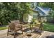Cozy backyard deck with wicker furniture, perfect for outdoor relaxation and entertaining in a lush green setting at 1520 Wakendaw Rd, Mount Pleasant, SC 29464