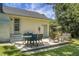 A backyard featuring a wooden deck with multiple seating areas and well maintained grass at 1520 Wakendaw Rd, Mount Pleasant, SC 29464