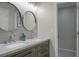 Bright bathroom featuring a double sink vanity with modern faucets and double mirrors at 1520 Wakendaw Rd, Mount Pleasant, SC 29464