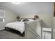 Spacious bedroom features soft lighting and staircase with laundry in background at 1520 Wakendaw Rd, Mount Pleasant, SC 29464