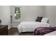 Bedroom with hardwood floors, neutral paint, two twin beds, and a window providing natural light at 1520 Wakendaw Rd, Mount Pleasant, SC 29464