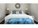 Bright bedroom featuring a bed with stylish pillows and lamps on bedside tables at 1520 Wakendaw Rd, Mount Pleasant, SC 29464