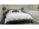 Bright bedroom featuring a comfortable bed with white linens, bedside tables, and lamps at 1520 Wakendaw Rd, Mount Pleasant, SC 29464