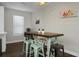 Dining area with wooden table, modern chairs, and nautical-themed artwork at 1520 Wakendaw Rd, Mount Pleasant, SC 29464