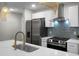 Kitchen features stainless steel appliances, modern cabinetry, and a stylish backsplash at 1520 Wakendaw Rd, Mount Pleasant, SC 29464
