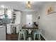 Kitchen leads to dining area with wooden table, then connects to other side of kitchen at 1520 Wakendaw Rd, Mount Pleasant, SC 29464