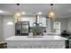 Modern kitchen featuring stainless steel appliances, white cabinets, and pendant lighting at 1520 Wakendaw Rd, Mount Pleasant, SC 29464