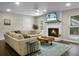 Cozy living room features a fireplace, comfortable seating, and a stylish blue rug at 1520 Wakendaw Rd, Mount Pleasant, SC 29464