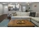 The living room is open to the kitchen with a sectional sofa and wooden coffee table at 1520 Wakendaw Rd, Mount Pleasant, SC 29464