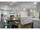 Open-concept living space with eat in kitchen, dining, living room, and fireplace at 1520 Wakendaw Rd, Mount Pleasant, SC 29464