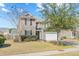 Charming two-story home with a well-manicured lawn and a two-car garage, nestled on a tree-lined street at 153 Berwick Dr, Summerville, SC 29483