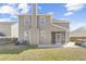 Exterior view of the home showcasing the screened porch and backyard with a hot tub at 153 Berwick Dr, Summerville, SC 29483