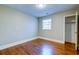 Bedroom with hardwood floors, closet and light filled window at 1556 Larry St, North Charleston, SC 29405