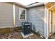 Home exterior showcasing an A/C unit with modern gray wood siding and trim at 1556 Larry St, North Charleston, SC 29405