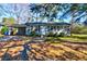 Traditional style home with a carport and tidy landscaping at 1556 Larry St, North Charleston, SC 29405