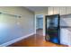 Kitchen area with refrigerator and hardwood floors at 1556 Larry St, North Charleston, SC 29405