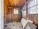 Unfinished room space with plywood walls, pegboard, and windows, offering potential for customization and storage at 1556 Larry St, North Charleston, SC 29405
