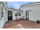 Back porch with chairs and a door leading into the home, perfect for relaxing outdoors at 17 Anita Dr, Charleston, SC 29407