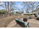 Backyard with a fire pit, chairs, and a cozy seating area, ideal for outdoor gatherings at 17 Anita Dr, Charleston, SC 29407