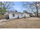 Backyard featuring a well maintained lawn and a patio area with outdoor seating and a grill at 17 Anita Dr, Charleston, SC 29407