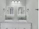 Bathroom featuring double sinks with marble countertops, and a matching set of vanity mirrors at 17 Anita Dr, Charleston, SC 29407
