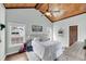 Comfortable bedroom with wood ceiling, white bedding, and natural light from two windows at 17 Anita Dr, Charleston, SC 29407