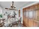 Open dining area with wood floors and access to the kitchen and living room at 17 Anita Dr, Charleston, SC 29407