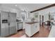 Modern kitchen featuring a center island, white cabinets, and hardwood floors at 17 Anita Dr, Charleston, SC 29407