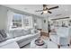Inviting living room with a large window, light sofa, and hardwood floors at 17 Anita Dr, Charleston, SC 29407