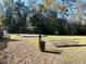 Community playground featuring swings and a picnic table in a leafy, green neighborhood park at 17 Anita Dr, Charleston, SC 29407