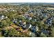 Prime real estate featuring lush landscaping, a serene pool, and proximity to waterways and a bridge at 184 Scott St, Daniel Island, SC 29492