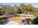 Well-maintained backyard featuring stamped concrete patio with seating and manicured lawn at 184 Scott St, Daniel Island, SC 29492
