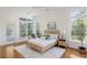 Inviting bedroom featuring a large window, neutral decor, and a plush rug for added comfort at 184 Scott St, Daniel Island, SC 29492