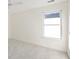 Bright bedroom with neutral carpet, large window offering ample natural light, and a fresh, airy feel at 184 Scott St, Daniel Island, SC 29492