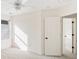 Bright bedroom with an open door, neutral carpet, and window offering a well-lit and airy atmosphere at 184 Scott St, Daniel Island, SC 29492