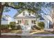 Inviting two-story home with a covered front porch, white columns, and well-maintained landscaping at 184 Scott St, Daniel Island, SC 29492