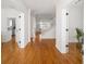 Inviting foyer features hardwood floors, bright white walls, and views of the staircase and kitchen at 184 Scott St, Daniel Island, SC 29492