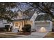 Inviting two-story home boasts a classic design with a spacious porch, manicured lawn and attached two-car garage at 184 Scott St, Daniel Island, SC 29492